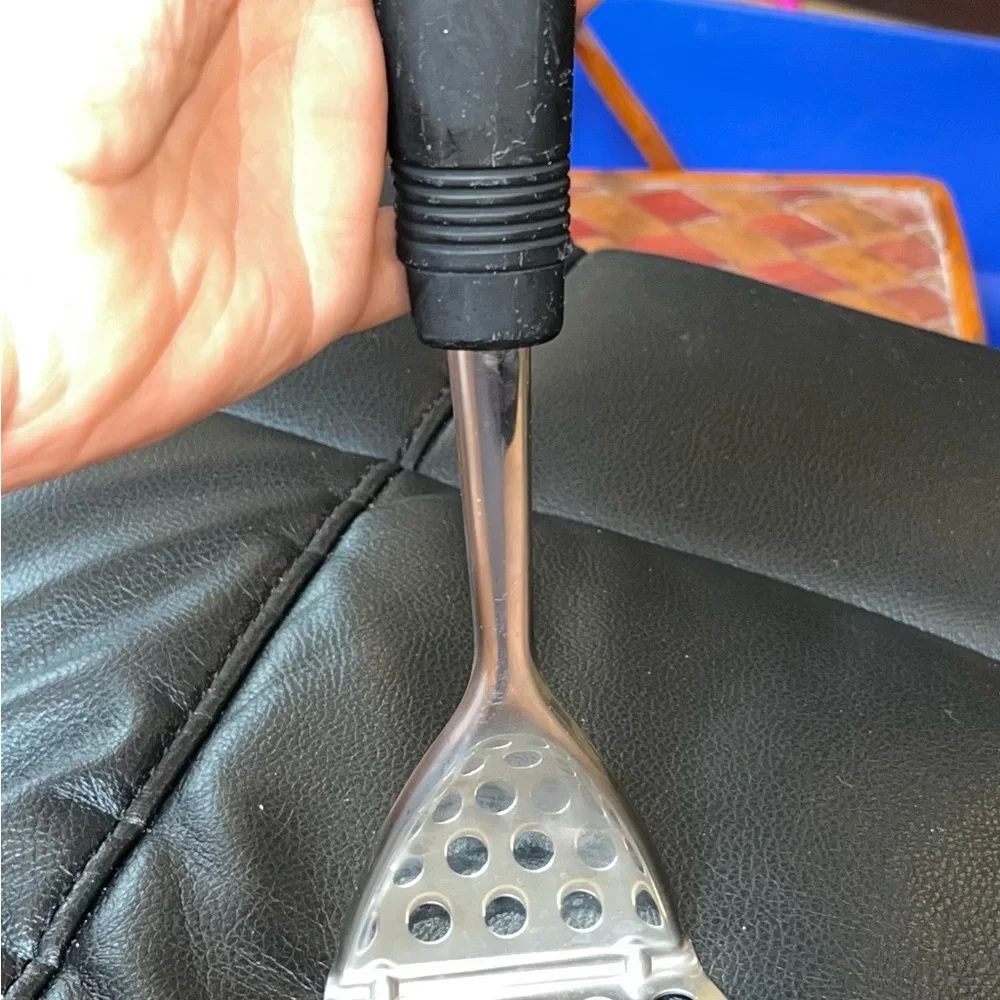 Stainless steel curved potato masher
